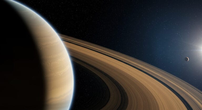 A breathtaking view showcases Saturn's rings, a celestial body, and a distant moon